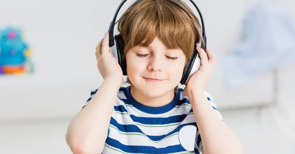 snoop dogg affirmations for kids + A boy is wearing headphones and listening to affirmations