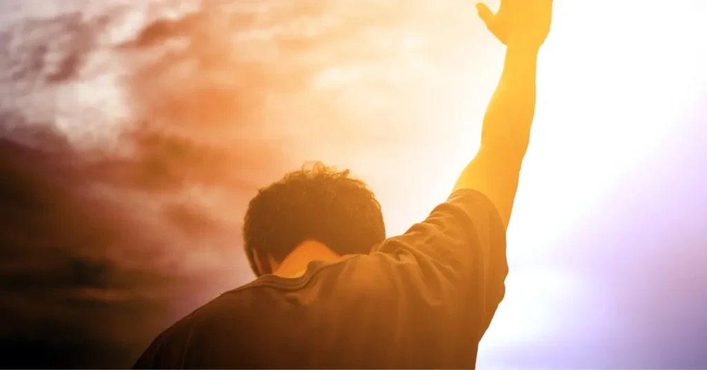 good morning prayer for him + A man holds his right hand towards the sky