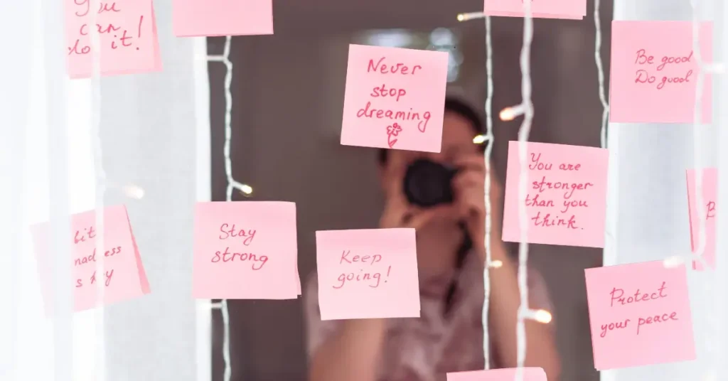 how to write affirmations + Several small notes with affirmations are stuck on the mirror